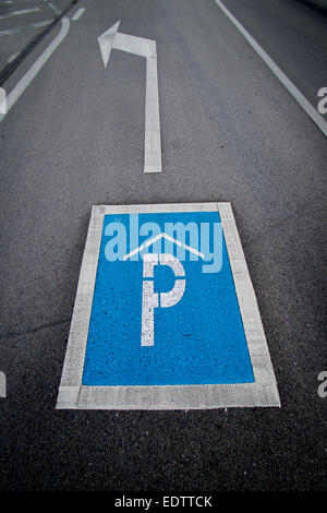 arrow to car park sign on the tarmac Stock Photo