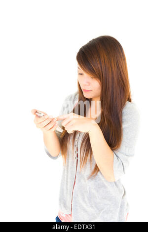 Asian woman chat with someone by moblie phone on white background and blank area at left side Stock Photo