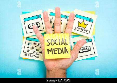 Social media on hand with blue background Stock Photo