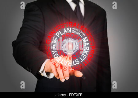 Businessman clicking on a business target Stock Photo