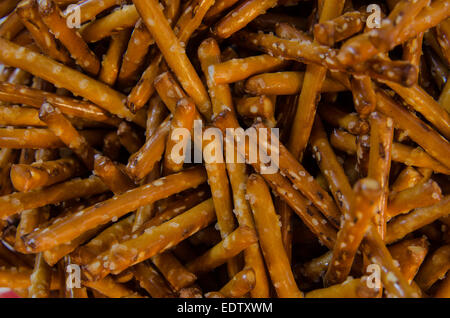 A background image of pretzel sticks in a jar Stock Photo