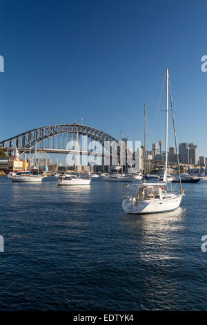 Lavender Bay boats in harbour view to Sydney Harbour Bridge and CBD skyline at sunset North Shore Sydney NSW Australia Stock Photo
