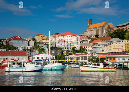 The Carenage - inner harbor in St Georges with Cathedral of the Immaculate Conception beyond, Grenada, West Indies Stock Photo