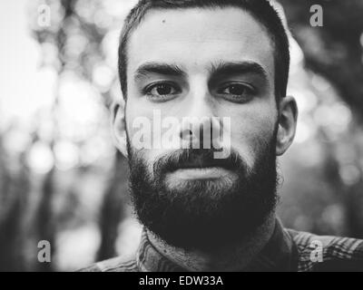 Hipster man portrait  in black and white in horizontal composition. Stock Photo