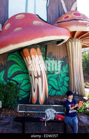 Chicago Illinois,North River,Clark Street,Rainforest Cafe,restaurant restaurants food dining cafe cafes,outside exterior,giant mushrooms,Asian woman f Stock Photo