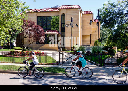 Chicago Illinois,South Side,South Woodlawn Avenue,former Elijah Mohammad residence,mansion,gate,gated,adult adults woman women female lady,bikers,bicy Stock Photo