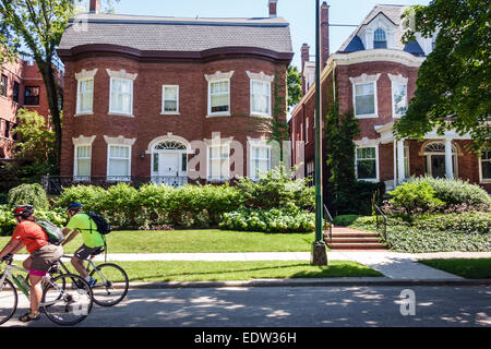Chicago Illinois,South Side,South Woodlawn Avenue,houses,homes,mansions,adult adults woman women female lady,bikers,bicycles,biking,riding,visitors tr Stock Photo