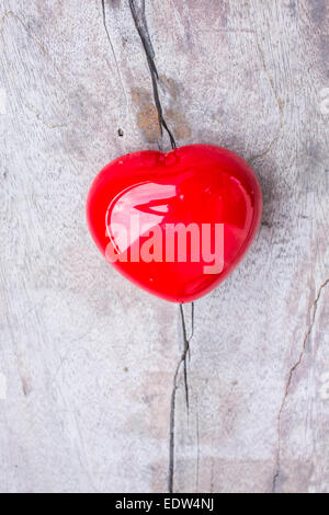 Red heart shapes on the wooden floor Stock Photo - Alamy
