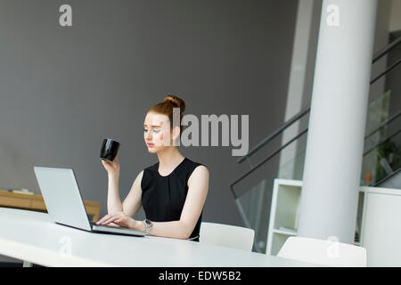 Young woman in the office Stock Photo