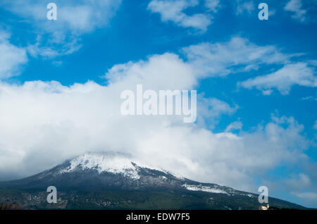 Cloudy Vesuvius with snow from Torre del Greco point of view (Naples) Stock Photo