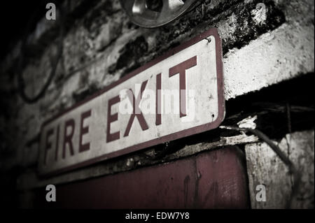 Old enamel fire exit sign Stock Photo