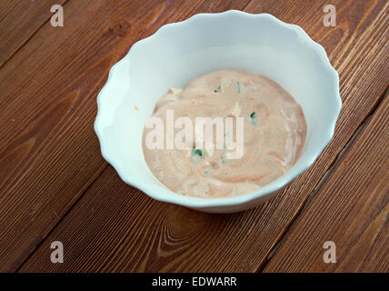 Russian dressing -  Rose sauce made of a blend of mayonnaise and ketchup complemented Stock Photo