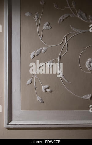 old frame with plaster stucco on the wall Stock Photo
