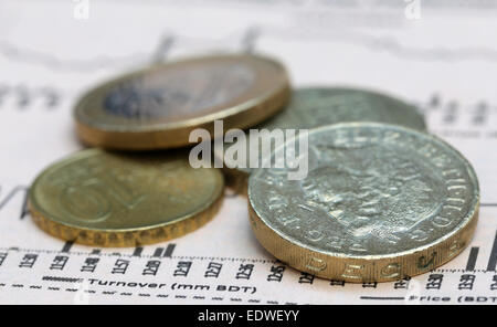 Currencies on financial graph on paper Stock Photo