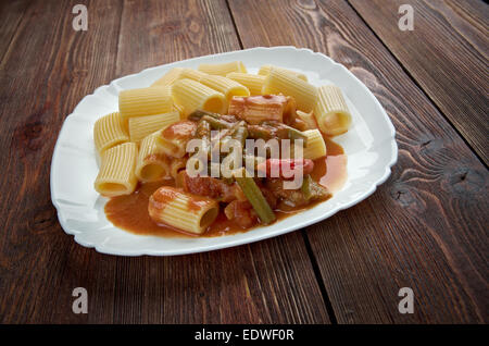 Italian food. Pasta Rigatoni with green beans and tomato sauce Stock Photo