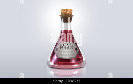 A regular old goblet glass bottle filled with a pink liquid with a label showing it is love potion and sealed with a cork on an Stock Photo