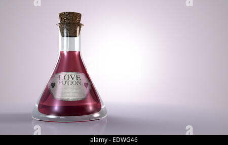 A regular old goblet glass bottle filled with a pink liquid with a label showing it is love potion and sealed with a cork on an Stock Photo