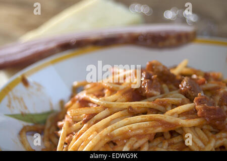 tasty Italian speciality: spaghetti all'amatriciana or spaghetti with a tomato sauce with pancetta Stock Photo