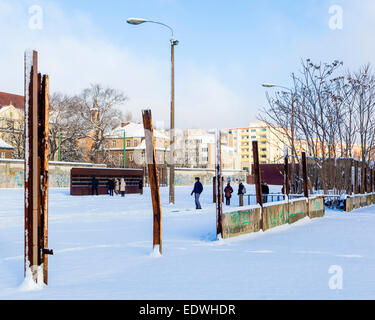 The Berlin Wall Memorial after snow in Winter. Rusty poles and wall remnants and wall of victims' photos, Bernauerstrasse, Mitte Stock Photo