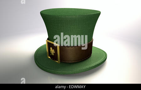 A green material leprechaun hat with a brown leather band emblazened with a gold shamrock and buckle on an isolated background Stock Photo