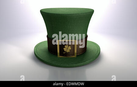 A green material leprechaun hat with a brown leather band emblazened with a gold shamrock and buckle on an isolated background Stock Photo