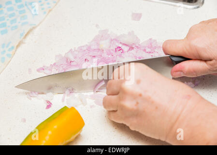 hands cutting onion diced small Stock Photo