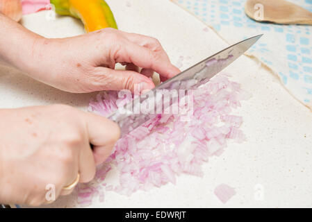 hands cutting onion diced small Stock Photo