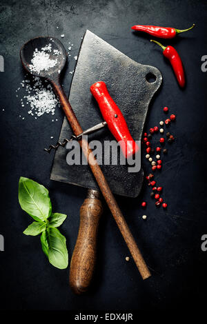 Vintage cutlery and fresh ingredients on dark background Stock Photo