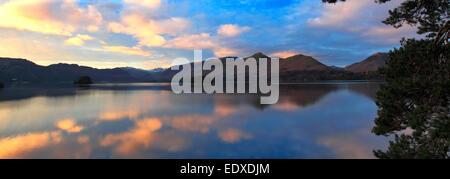 Dawn Sunrise over Cat Bells Fells reflected in Derwentwater lake, Keswick town, Lake District National Park, Cumbria, England,UK Stock Photo