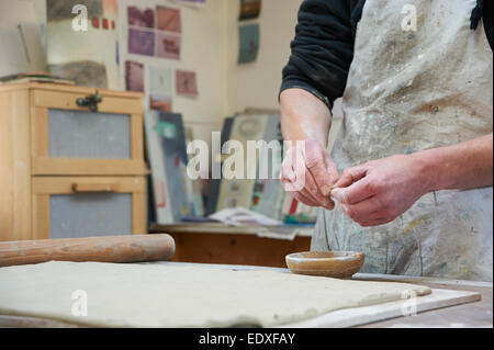 Ceramicist working in his studio Stock Photo