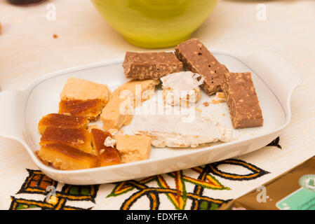 dish with various kinds of nougat on the table Stock Photo