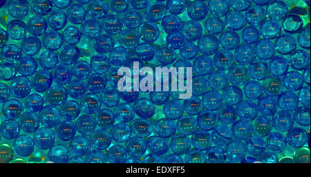 This abstract of marble-sized balls made from a colorfast polymer that absorbs, stores and releases water also makes an eye-catching background. Stock Photo