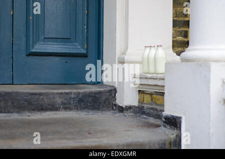 Milk delivery - milk bottles on doorstep Stock Photo