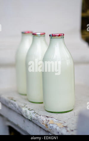 Milk delivery - milk bottles on doorstep Stock Photo