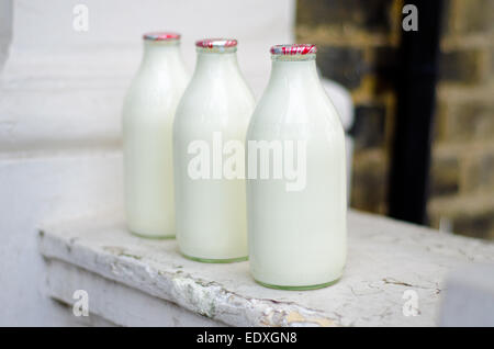 Milk delivery - milk bottles on doorstep Stock Photo