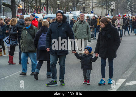 Paris, Street, France. Family Holding Hands, people march street in huge  Na-tional Demonstration Against Terrorism, After Attack on French News-paper, 'Charlie Hebdo', Stock Photo