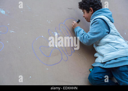 Paris, France. National Demonstration Against Terrorism, After Attack on French Newspaper, Charlie Hebdo, Young Boy Drawing 'je suis Charlie paris' on Wall, urban youths Stock Photo