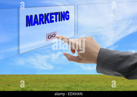 asian business man hand push on marketing button on touch screen panel for business concept Stock Photo