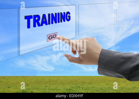 asian business man hand push on training button on touch screen panel for business concept Stock Photo