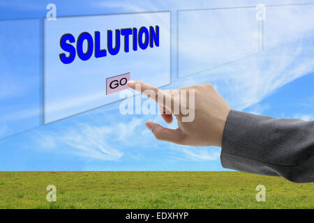 asian business man hand push on Solution button on touch screen panel for business concept Stock Photo