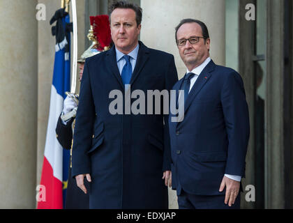 (150111) -- PARIS, Jan. 11, 2015 (Xinhua) -- French President Francois Hollande (R) welcomes British Prime Minister David Cameron at the Elysee Palace in Paris, France, Jan. 11, 2015. A massive march commenced Sunday afternoon in Paris with the participation of French President Francois Hollande and leaders from dozens of foreign countries. More than a million French would walk in the streets of Paris in honor of the 17 victims killed during the three days deadly terrorist attack. (Xinhua/Chen Xiaowei) Stock Photo