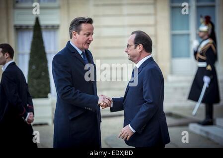 (150111) -- PARIS, Jan. 11, 2015 (Xinhua) -- French President Francois Hollande (R) shakes hands with British Prime Minister David Cameron at the Elysee Palace in Paris, France, Jan. 11, 2015. A massive march commenced Sunday afternoon in Paris with the participation of French President Francois Hollande and leaders from dozens of foreign countries. More than a million French would walk in the streets of Paris in honor of the 17 victims killed during the three days deadly terrorist attack. (Xinhua/Chen Xiaowei) Stock Photo
