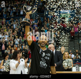 Birmingham, UK. 11th January, 2015.  ESH Newcastle Eagles Charles Smith shows the BBL Trophy to the fans over Glasgow Rocks 84-71.   Credit:  Stephen Bartholomew/Alamy Live News Stock Photo