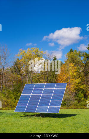 IRASVILLE, VERMONT, USA - Solar power panel in field, Mad River Valley. Alternative energy. Stock Photo
