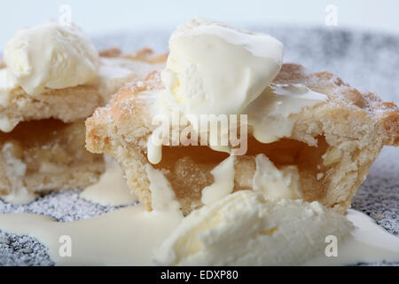 small apple pie covered in cream Stock Photo
