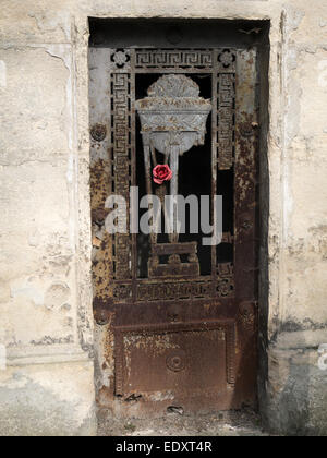 An artificial rose decorates a mausoleum in a cemetery in Paris, France Stock Photo