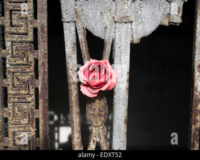 An artificial rose decorates a mausoleum in a cemetery in Paris, France Stock Photo