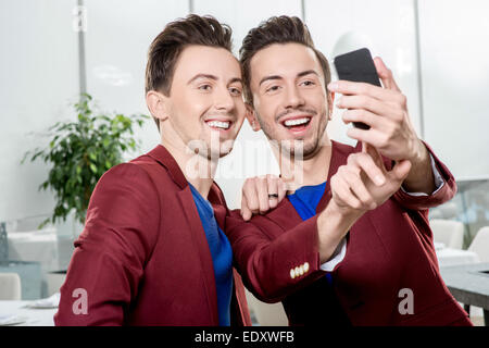 Brothers twins taking selfie photo Stock Photo