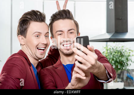 Brothers twins taking selfie photo Stock Photo