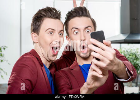 Brothers twins taking selfie photo Stock Photo